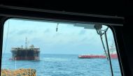 An empty vessel reported to be Kyoto 2 (L), that was towed by the missing ship on its way from the South Korean city of Busan to Indonesia's Batam port, is seen after being found near the Penghu Islands, in the Taiwan Strait, April 8, 2022. Taiwan Coastguard/Handout via REUTERS