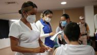 A child receives a dose of the Pfizer-BioNTech coronavirus disease (COVID-19) vaccine during a vaccination program for minors between the ages of 12 to 17 with underlying medical conditions or disability at a hospital in Ciudad Juarez, Mexico October 19, 2021. REUTERS/Jose Luis Gonzalez/File Photo
