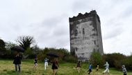 Ukrainian refugee children from Dnipro and Zaporizhzhia play football on the grounds of15th Century Ballindooley Castle in Galway, Ireland, April 16, 2022. Owner Barry Haughian has offered his castle as shelter for two families of Ukrainian refugees to stay in. Picture taken April 16, 2022. REUTERS/Clodagh Kilcoyne