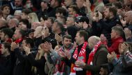 April 19, 2022 Liverpool fans applaud on the seventh minute for Manchester United 's Cristiano Ronaldo and his family REUTERS/Phil Noble
