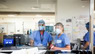 Emergency room nurse Janelle Van Halteren, right, speaks with her colleague as the Omicron coronavirus variant continues to put pressure on Humber River Hospital in Toronto, Ontario, Canada January 20, 2022. REUTERS/Carlos Osori

