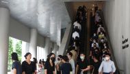 Office workers go for lunch at the central business district on the first day free of coronavirus disease (COVID-19) restrictions in Singapore, April 26, 2022. REUTERS/Edgar Su