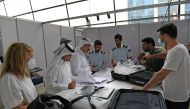 Custom officials dealing with exhibitors.