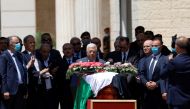 Palestinian President Mahmoud Abbas bids farewell to Al Jazeera journalist Shireen Abu Akleh, who was killed during an Israeli raid, in Ramallah in the Israeli-occupied West Bank May 12, 2022. Reuters/Mohamad Torokman