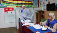 An electoral worker shows an empty ballot box at a polling station before it opens for the parliamentary election, in Beirut, Lebanon May 15, 2022. REUTERS/Mohamed Azakir
