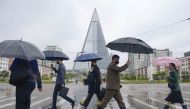 People wearing protective face masks walk amid concerns over the new coronavirus disease (COVID-19) in Pyongyang, North Korea May 15, 2020, in this photo released by Kyodo. Mandatory credit Kyodo/via REUTERS/File Photo

