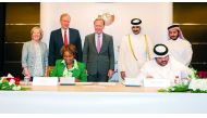 Minister of Culture H E Sheikh Abdulrahman bin Hamad bin Jassim bin Hamad Al Thani and other officials look on as the agreement is signed.