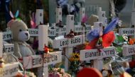 Flowers, toys, and other objects to remember the victims of the deadliest U.S. school mass shooting resulting in the death of 19 children and two teachers, are seen at a memorial at Robb Elementary School in Uvalde, Texas, U.S. May 30, 2022. Picture taken May 30, 2022. REUTERS/Veronica G. Cardenas
