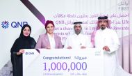 Final winner of the 1 Million Life Rewards points Sara Khalil, receives her prize from officials from QNB and MoCI, in Doha, recently.  