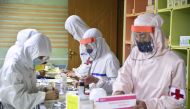 Members of the North Korean army supply medicines to residents at a pharmacy in Pyongyang, North Korea, in this photo released by Kyodo on May 18, 2022. Kyodo/via Reuters