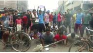 Demonstrators perform push-ups as they protest against 