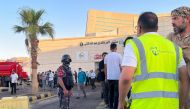 People stand outside a hospital after toxic gas leak from a storage tank in Jordan's Aqaba port, on June 27, 2022. (Reuters/Abraham Farajian)