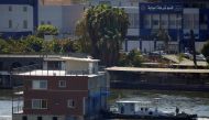 A government's boat pushes a houseboat on the River Nile, in Cairo, Egypt, on June 28, 2022. (Reuters/Amr Abdallah Dalsh)