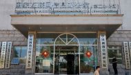 A man walks past an office of the Cyberspace Administration of China (CAC) in Beijing, China July 8, 2021. REUTERS/Thomas Peter