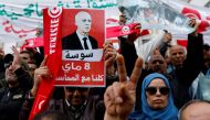 People carry banners and flags during a rally in support of Tunisian President Kais Saied in Tunis, Tunisia, on May 8, 2022. (Reuters/Zoubeir Souissi)