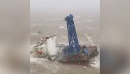 A vessel is seen sinking after it snapped in two as tropical storm Chaba passed through, according to authorities, in waters off Hong Kong, China July 2, 2022. Hong Kong Government Flying Service/Handout via REUTERS