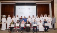 Qatargas and Qatar University officials with winners of the 18th Plant Design Competition at the award ceremony.