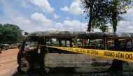 One of the prison buses burnt during the attack by several gunmen at the medium-security prison in Kuje, near the capital Abuja, Nigeria, July 6, 2022. (Reuters/Afolabi Sotunde)

