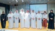 Minister of State and QNL President H E Dr. Hamad bin Abdulaziz Al Kawari with officials and guests at a book signing event held at QNL. 