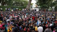 People wait to visit the President's house on the day after demonstrators entered the building, after President Gotabaya Rajapaksa fled, amid the country's economic crisis, in Colombo, Sri Lanka July 10, 2022. REUTERS/Dinuka Liyanawatte