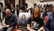 An image of slain Palestinian-American journalist Shireen Abu Akleh is placed on a chair, at a Palestinian President Mahmoud Abbas and US President Joe Biden news conference, in Bethlehem on July 15, 2022. (REUTERS/Evelyn Hockstein)
