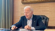 U.S. President Joe Biden, who tested positive for COVID-19 while experiencing mild symptoms, sits at his desk in the White House residence in this handout photo obtained from President Biden's Twitter account on July 21, 2022. Courtesy Twitter President Biden@POTUS/Handout via REUTERS