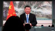 Chinese President Xi Jinping is seen on a giant screen at a media centre as he delivers a speech via video at the opening ceremony of the China International Import Expo (CIIE) in Shanghai, China November 4, 2021. REUTERS/Andrew Galbraith/File Photo
