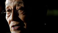 Former Philippine President Fidel Ramos speaks to journalists as he arrives at Hong Kong International Airport, China August 8, 2016. REUTERS/Tyrone Siu/File Photo