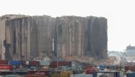 Dust rises as part of Beirut grain silos, damaged in the August 2020 port blast, collapses, in Beirut, Lebanon, on July 31, 2022. (REUTERS/Mohamed Azakir)