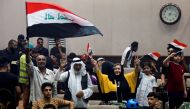 Supporters of Iraqi populist leader Moqtada al-Sadr gather during a sit-in at the parliament building, amid political crises in Baghdad, Iraq, July 31, 2022. (REUTERS/Khalid Al-Mousily)