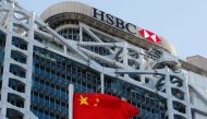 A Chinese national flag flies in front of HSBC headquarters in Hong Kong, China, July 28, 2020. REUTERS/Tyrone Siu

