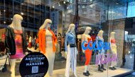 A sign advertising staff requirement is displayed on a store window at Lambton Quay, as the country experiences near record low unemployment, in Wellington, New Zealand August 3, 2022. Reuters/Lucy Craymer