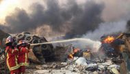 File Photo: Firefighters spray water at a fire after an explosion was heard in Beirut, Lebanon, August 4, 2020. (REUTERS/Mohamed Azakir)
