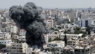 Smoke rises during an Israeli air strike, amid Israel-Gaza fighting, in Gaza City August 6, 2022. REUTERS/Mohammed Salem