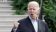 U.S. President Joe Biden gestures to the media as he walks towards Marine One for departure to Rehoboth Beach, Delaware from the South Lawn of the White House in Washington, D.C., U.S. August 7, 2022. REUTERS/Ken Cedeno