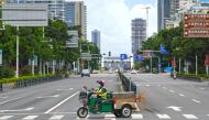 A sanitation worker drives past an intersection amid lockdown measures to curb the coronavirus disease (COVID-19) outbreak in Sanya, Hainan province, China August 6, 2022. cnsphoto via Reuters