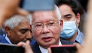 Former Malaysian Prime Minister Najib Razak speaks to journalists outside the Federal Court during a court break, in Putrajaya, Malaysia August 23, 2022. REUTERS/Lai Seng Sin
 
