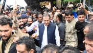 Pakistan's former Prime Minister, Imran Khan, who is facing terrorism charges, appears in court to extend pre-arrest bail, in Islamabad, Pakistan, August 25, 2022. (REUTERS/Waseem Khan)

