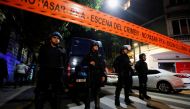 Police officers stand guard outside the house of Argentina's Vice President Cristina Fernandez de Kirchner in Buenos Aires on September 1, 2022.  REUTERS/Agustin Marcarian/File Photo