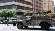 Lebanese army soldiers deploy outside an LGB Bank branch, where an armed man entered the branch seeking access to his own savings, according to a bank employee, in Ramlet al-Bayda area in Beirut, Lebanon, on September 16, 2022. (REUTERS/Mohamed Azakir)