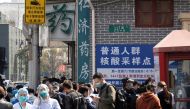 File Photo: Residents line up outside a nucleic acid testing site of a hospital, following cases of the coronavirus disease (COVID-19), in Shanghai, China, March 11, 2022. (REUTERS)