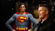 Propstore CEO Stephen Lane stands with Superman's (Christopher Reeve) complete costume from 