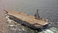 A US Navy F/A-18F Super Hornet approaches the USS Gerald R. Ford to use the new AAG arrested landing system. File Photo / Reuters