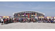 Participants pose for a group photo at Stadium 974.