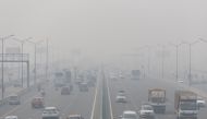 Traffic moves along a highway shrouded in heavy smog in New Delhi, India, November 3, 2022. (REUTERS/Adnan Abidi)