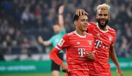 Bayern Munich's Cameroonian forward Eric Maxim Choupo-Moting (right) reacts with Bayern Munich's German midfielder Jamal Musiala during the German first division Bundesliga football match between Schalke 04 v Bayern Munich in Gelsenkirchen, Germany, on November 12, 2022. (Photo by UWE KRAFT / AFP)