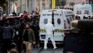 A forensic technician works after an explosion on busy pedestrian Istiklal street in Istanbul, Turkey, November 13, 2022. (REUTERS/Kemal Aslan)