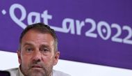 Germany's coach Hans-Dieter Flick attends a press conference at the Qatar National Convention Center (QNCC) in Doha on November 26, 2022, on the eve of the Qatar 2022 World Cup football match between Spain and Germany. Photo by Ina Fassbender / AFP