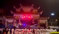 Riot police in personal protection suits (PPE) arrive during protests over coronavirus disease (COVID-19) restrictions, in Guangzhou, Guangdong province, China in this screen grab taken from a social media video released November 29, 2022. Video Obtained by Reuters/via Reuters 
