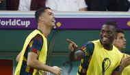 Portugal's Cristiano Ronaldo and Rafael Leao celebrate after Pepe scores their second goal as they watch from the substitutes bench REUTERS/Suhaib Salem